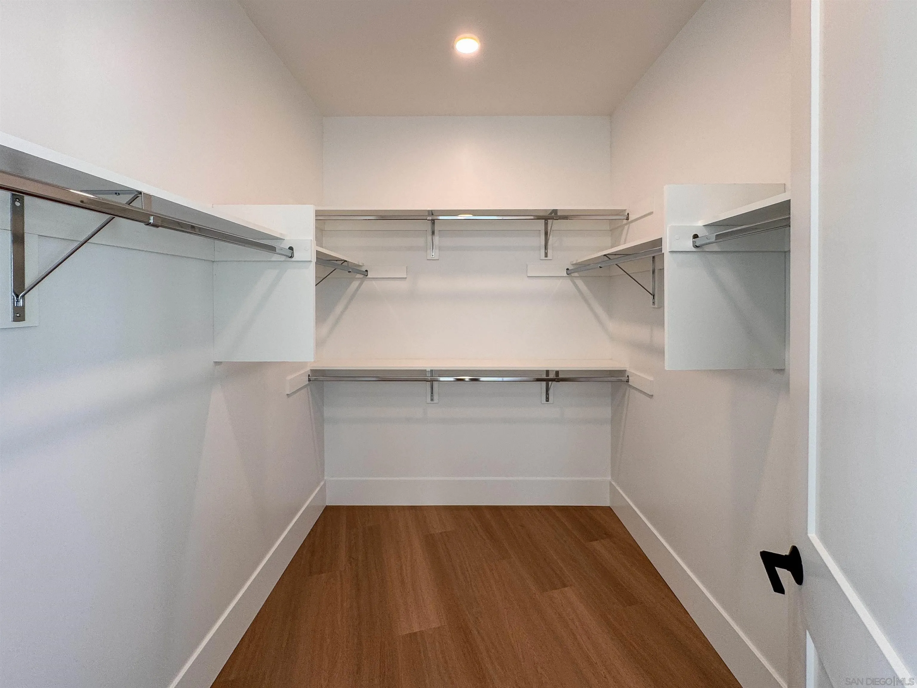 7290 Ponto Drive North, Unit 7302 Carlsbad, CA 92011 - Photo 27 of 55 a view of walk in closet with empty racks