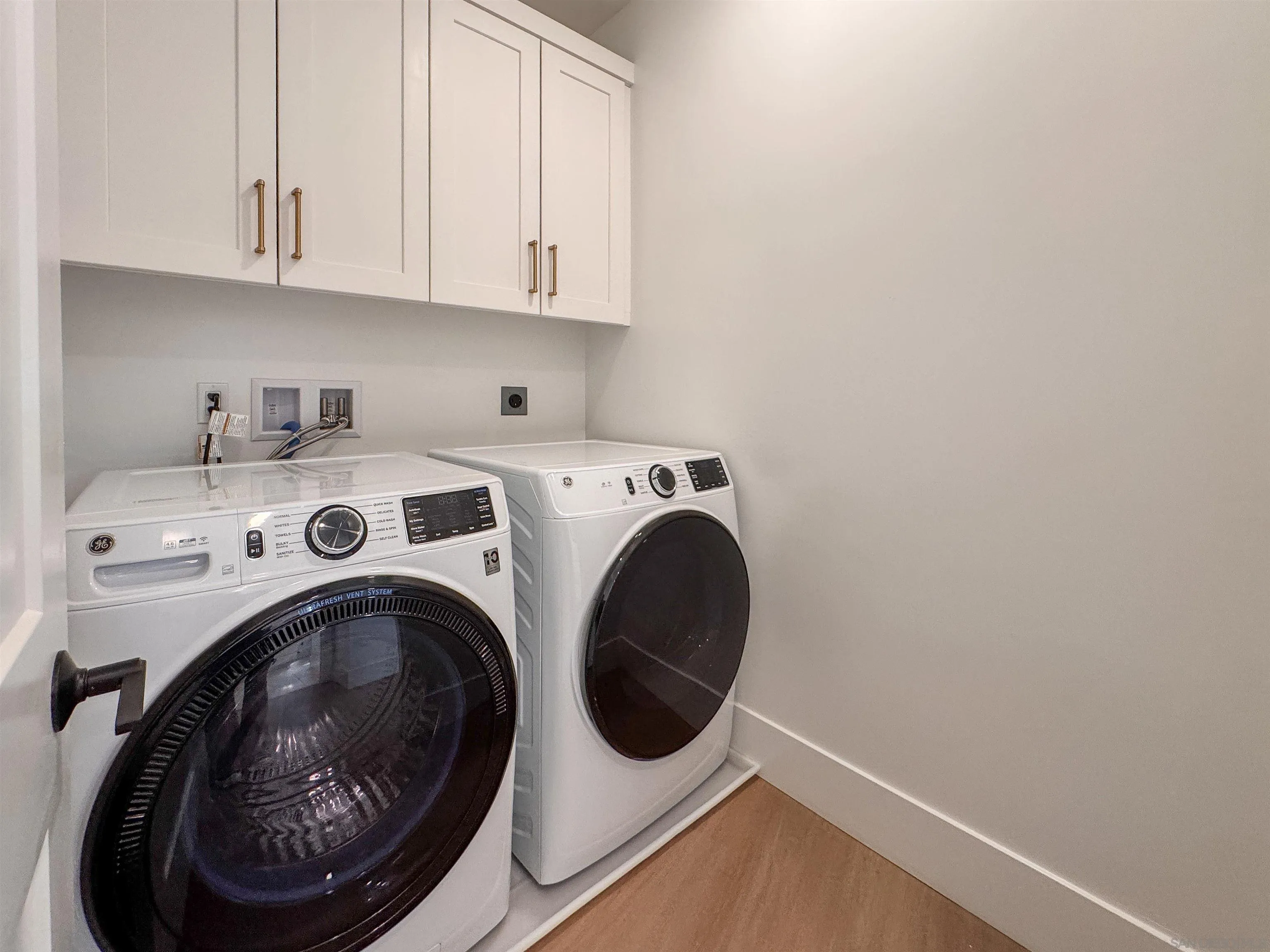 7290 Ponto Drive North, Unit 7302 Carlsbad, CA 92011 - Photo 33 of 55 a utility room with dryer and washer