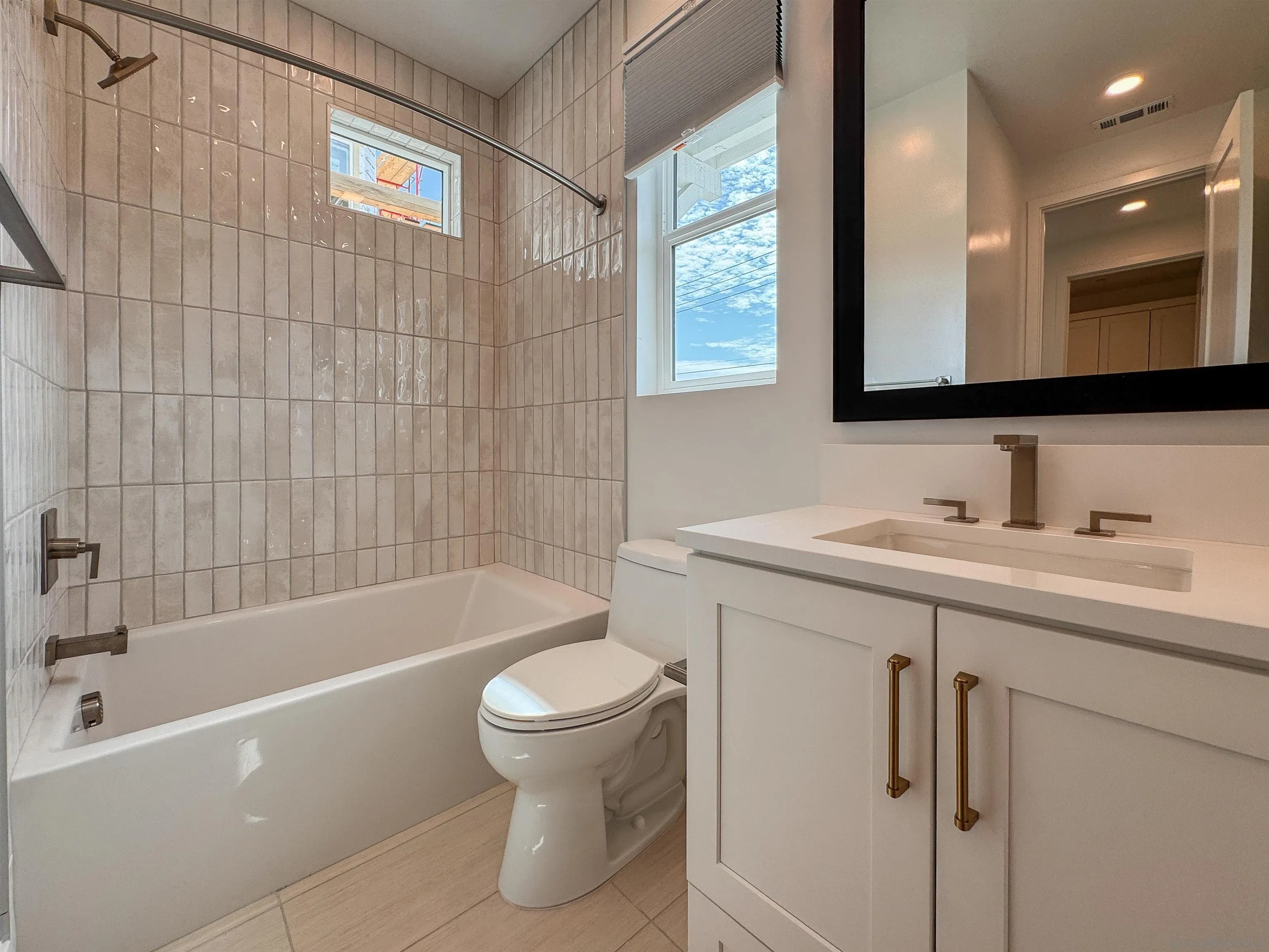 7290 Ponto Drive North, Unit 7302 Carlsbad, CA 92011 - Photo 34 of 55 a bathroom with a sink toilet and shower