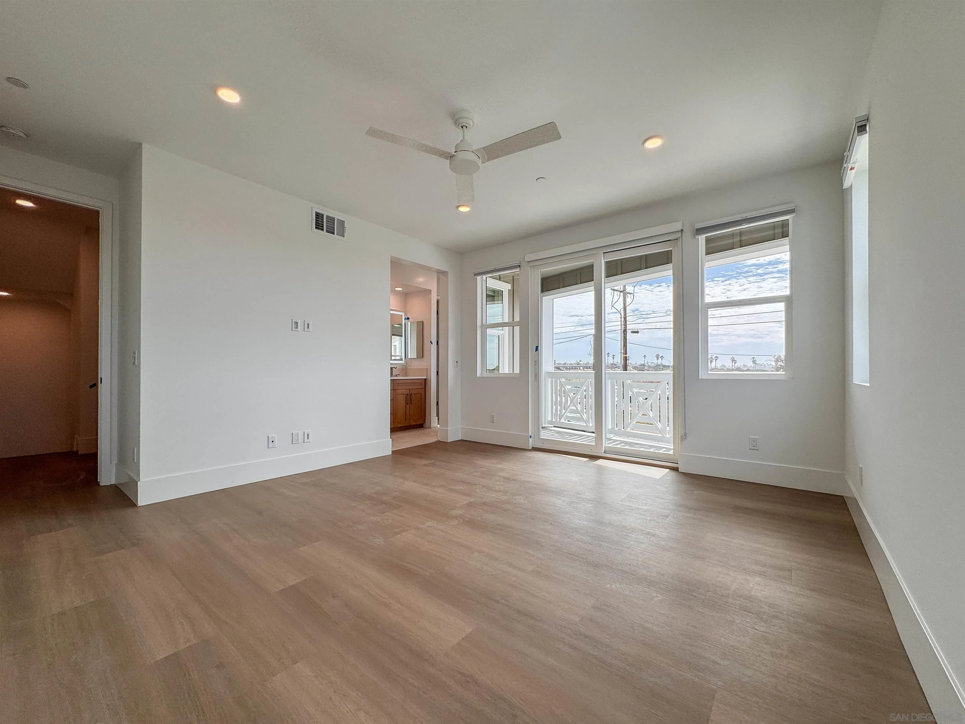 7290 Ponto Drive North, Unit 7302 Carlsbad, CA 92011 - Photo 41 of 55 wooden floor in an empty room with a window