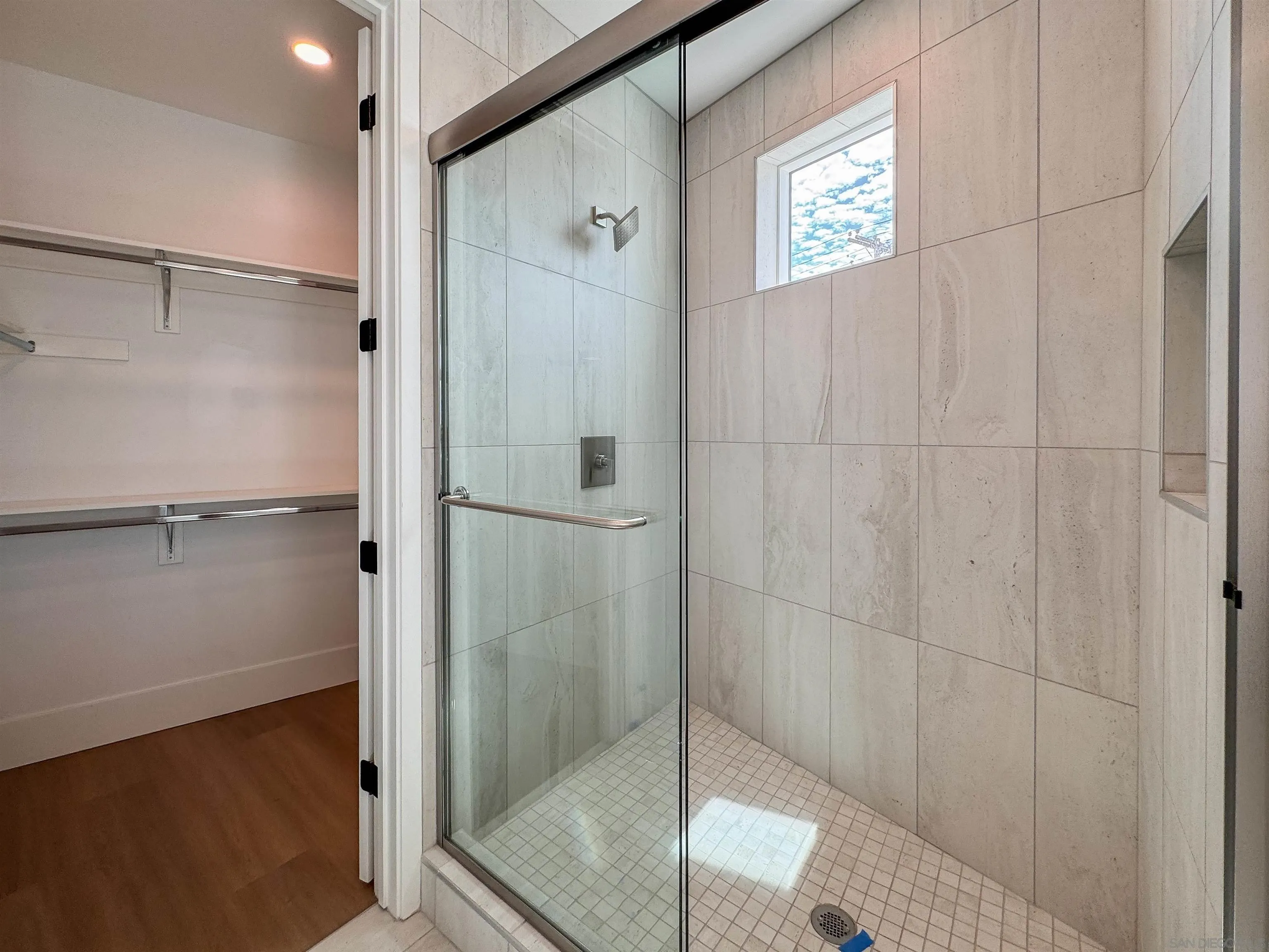 7290 Ponto Drive North, Unit 7302 Carlsbad, CA 92011 - Photo 46 of 55 a bathroom with a shower and a sink