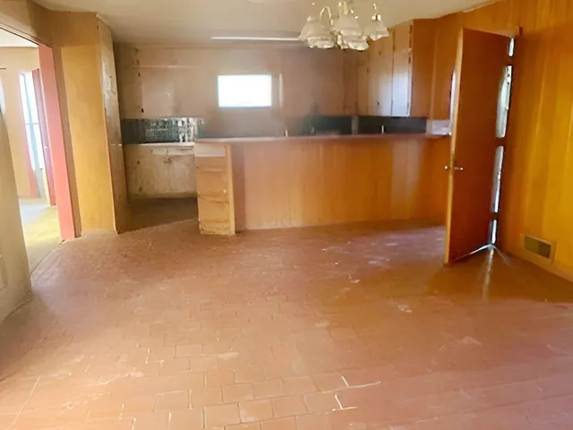a view of a kitchen with a sink cabinet and a living room