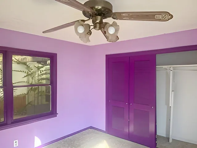 a view of a room with a large window