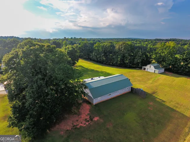 a view of a house with basketball court