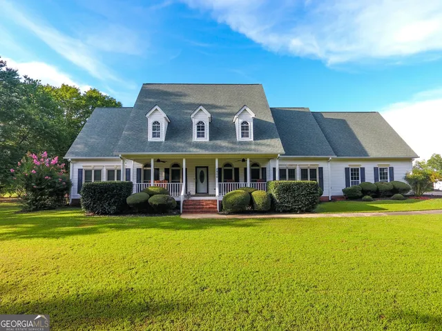 a kitchen with granite countertop a sink cabinets and window