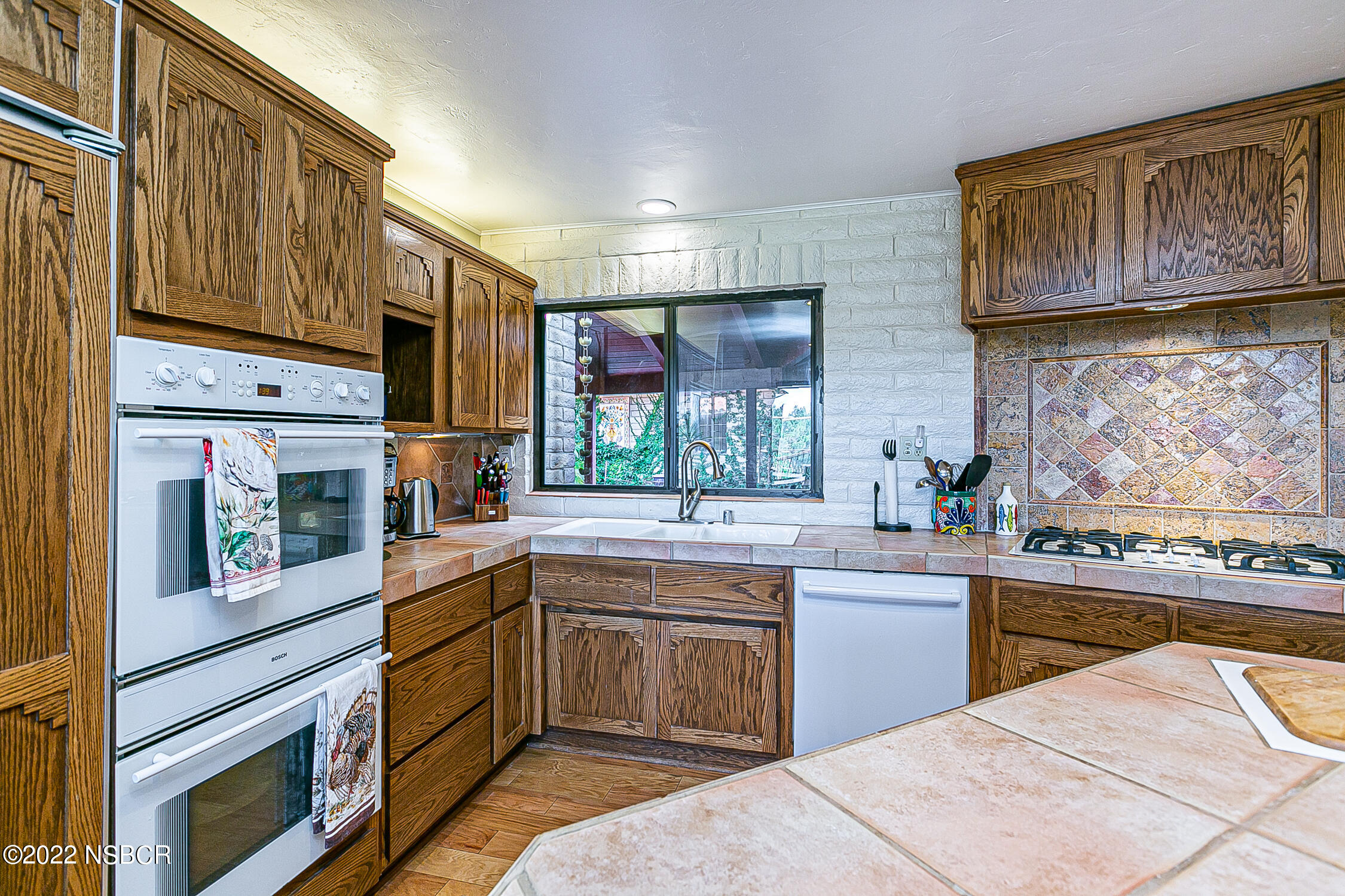 400 Oak Hill Drive Lompoc, CA 93436 - Photo 34 of 56 a kitchen with stainless steel appliances granite countertop a sink and cabinets