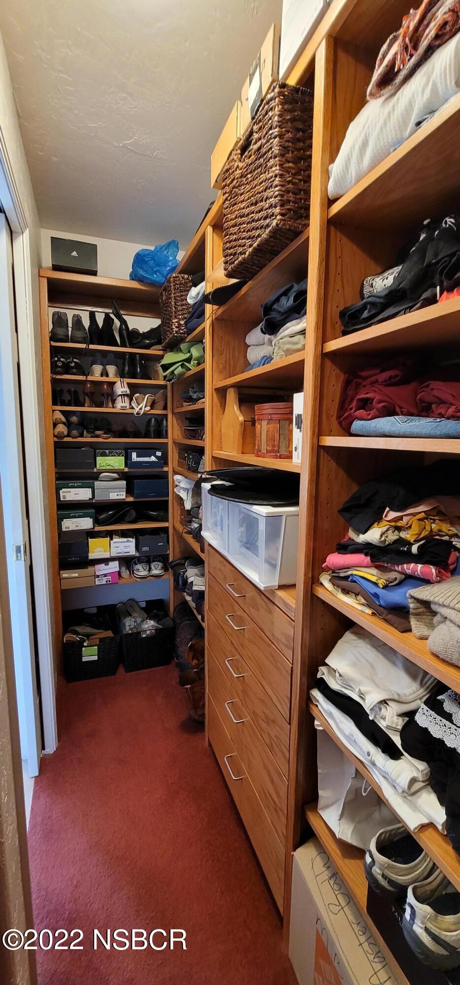 400 Oak Hill Drive Lompoc, CA 93436 - Photo 43 of 56 a view of walk in closet with clothes and shoes