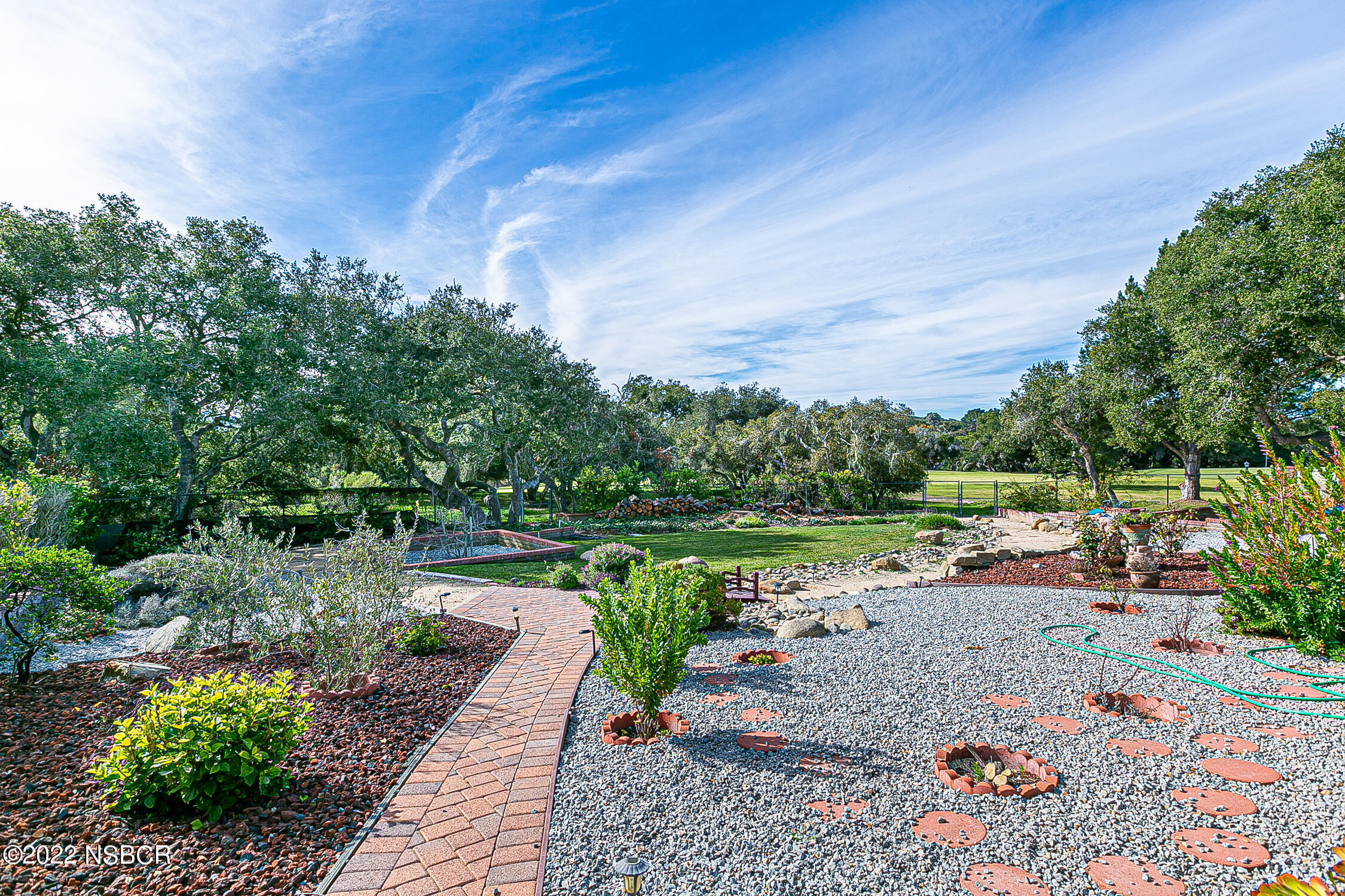 400 Oak Hill Drive Lompoc, CA 93436 - Photo 55 of 56 a view of a street with a bench and trees