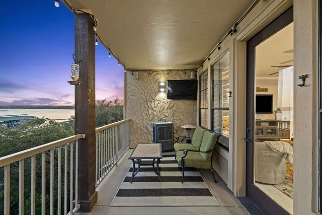 a balcony view with a seating space