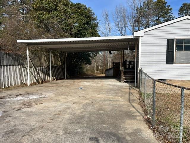 873 Armory Road Chester, SC 29706 - Photo 3 of 8 a view of backyard with large trees and wooden fence