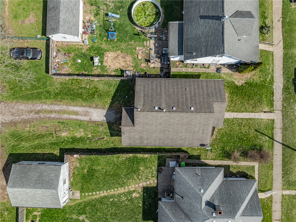 1005 Burt Street Springfield, OH 45505 - Photo 32 of 33 An aerial view captures the property's layout, showcasing its expansive grounds and surrounding homes.