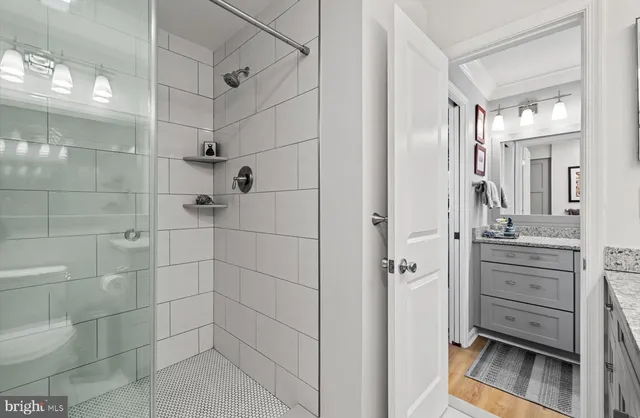 a bedroom with a bed and a lamp