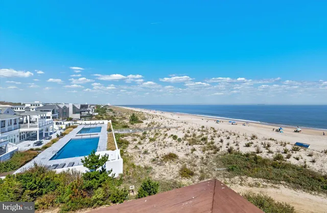 a bed sitting in a bedroom next to a lamp