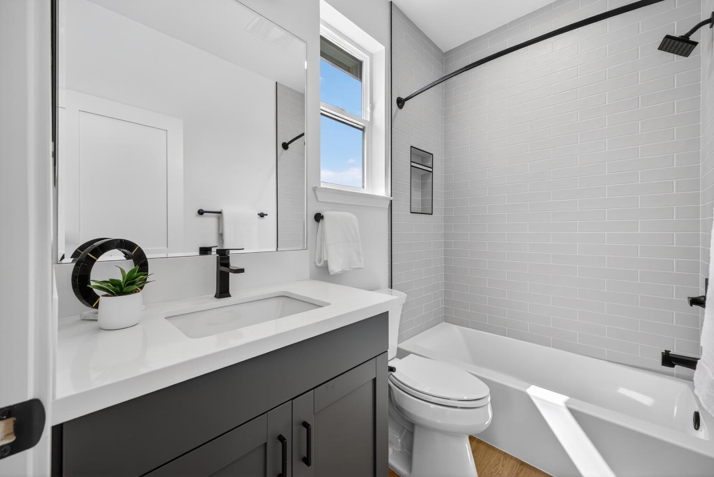 955 Woodside Road Redwood City, CA 94061 - Photo 41 of 46 a bathroom with a sink a toilet and shower