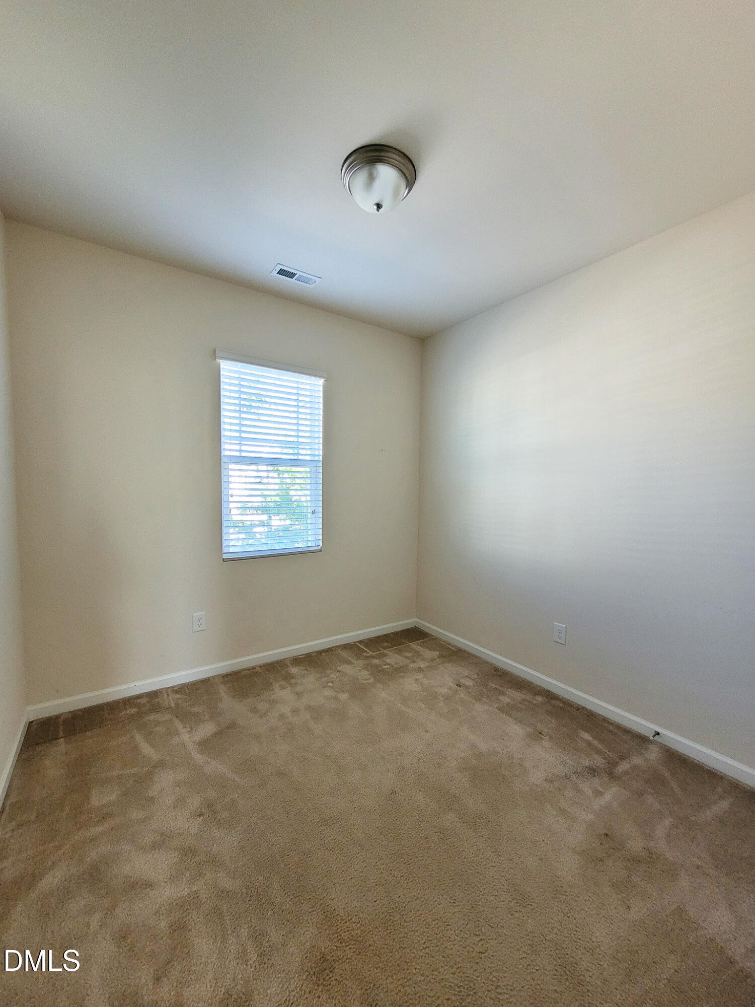 8951 Commons Townes Drive Raleigh, NC 27616 - Photo 25 of 40 an empty room with a window