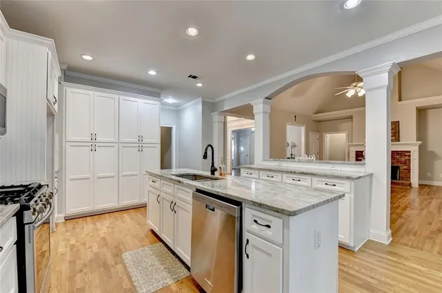 a view of empty room with window and ceiling fan