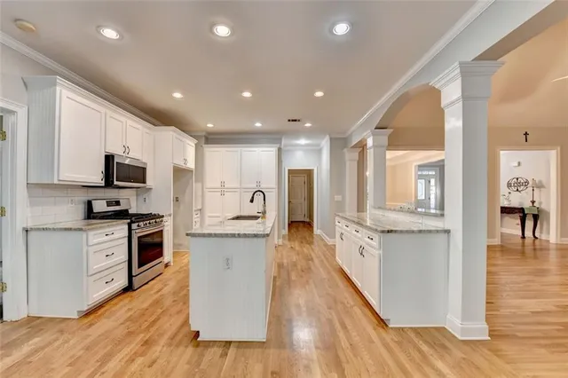 a bathroom with a sink toilet and tub