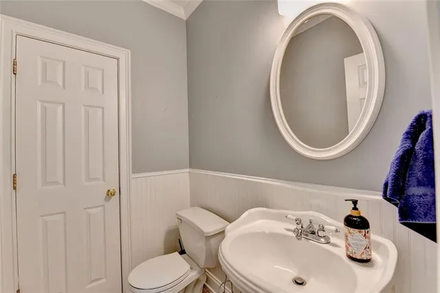 a view of an empty room with a chandelier