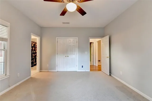 a view of a room with wooden floor and pool table