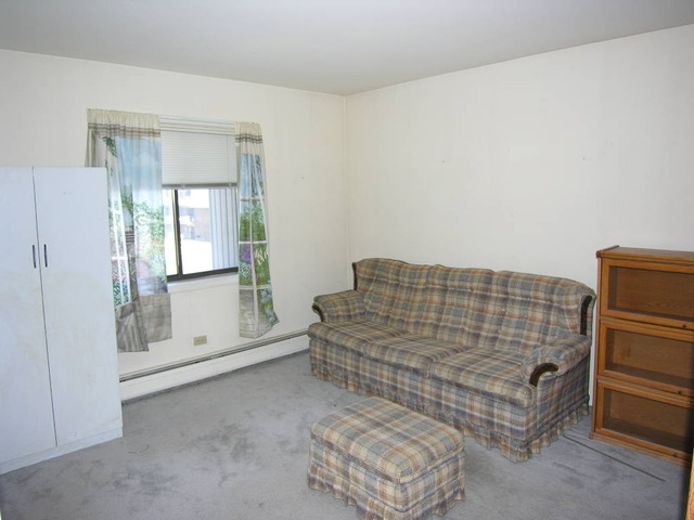 254 East Bailey Road, Unit L Naperville, IL 60565 - Photo 14 of 25 a bedroom with bed and window