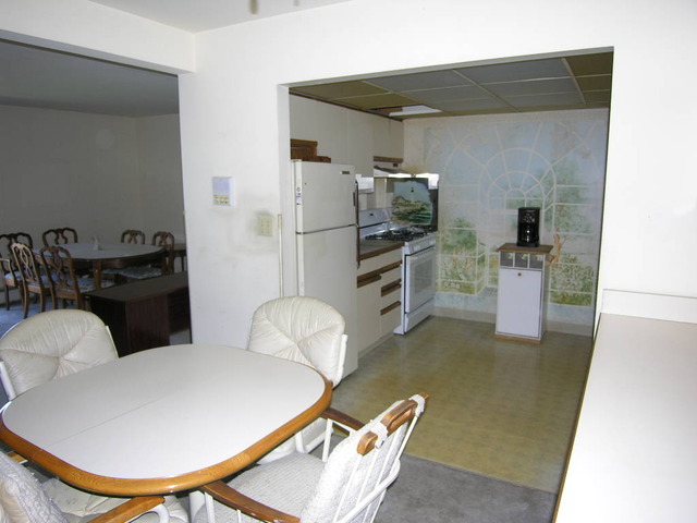 254 East Bailey Road, Unit L Naperville, IL 60565 - Photo 3 of 25 a room with furniture a flat screen tv and kitchen view