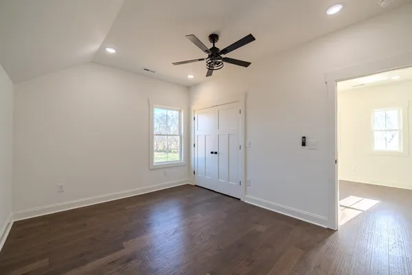 a bathroom with a double vanity sink and mirror