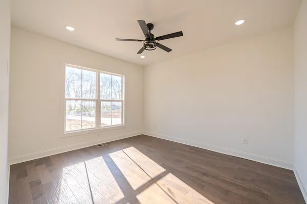 a view of a house with a yard and garage
