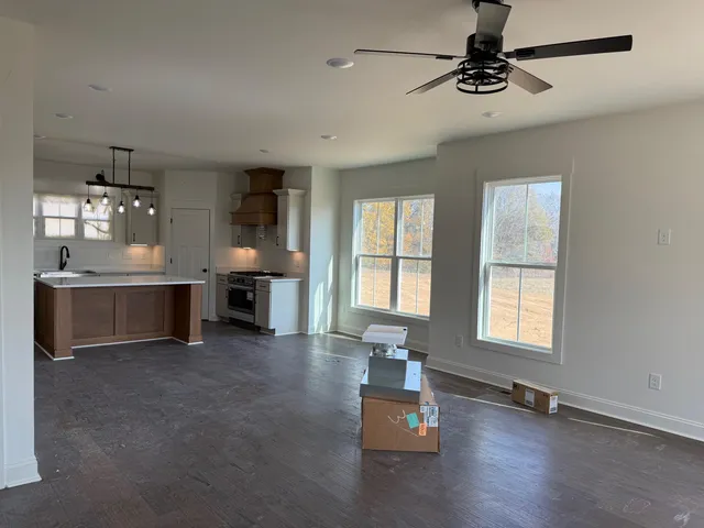 a view of a room with gym equipment and a window