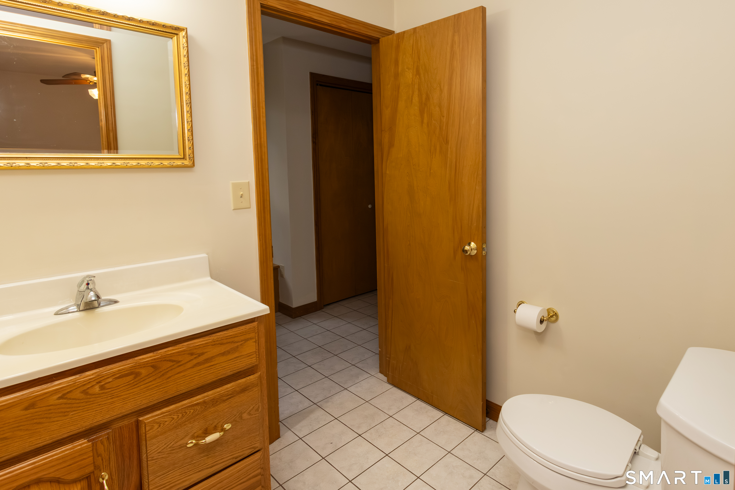 352 Carter Lane Southington, CT 06489 - Photo 17 of 40 a bathroom with a sink a toilet and shower