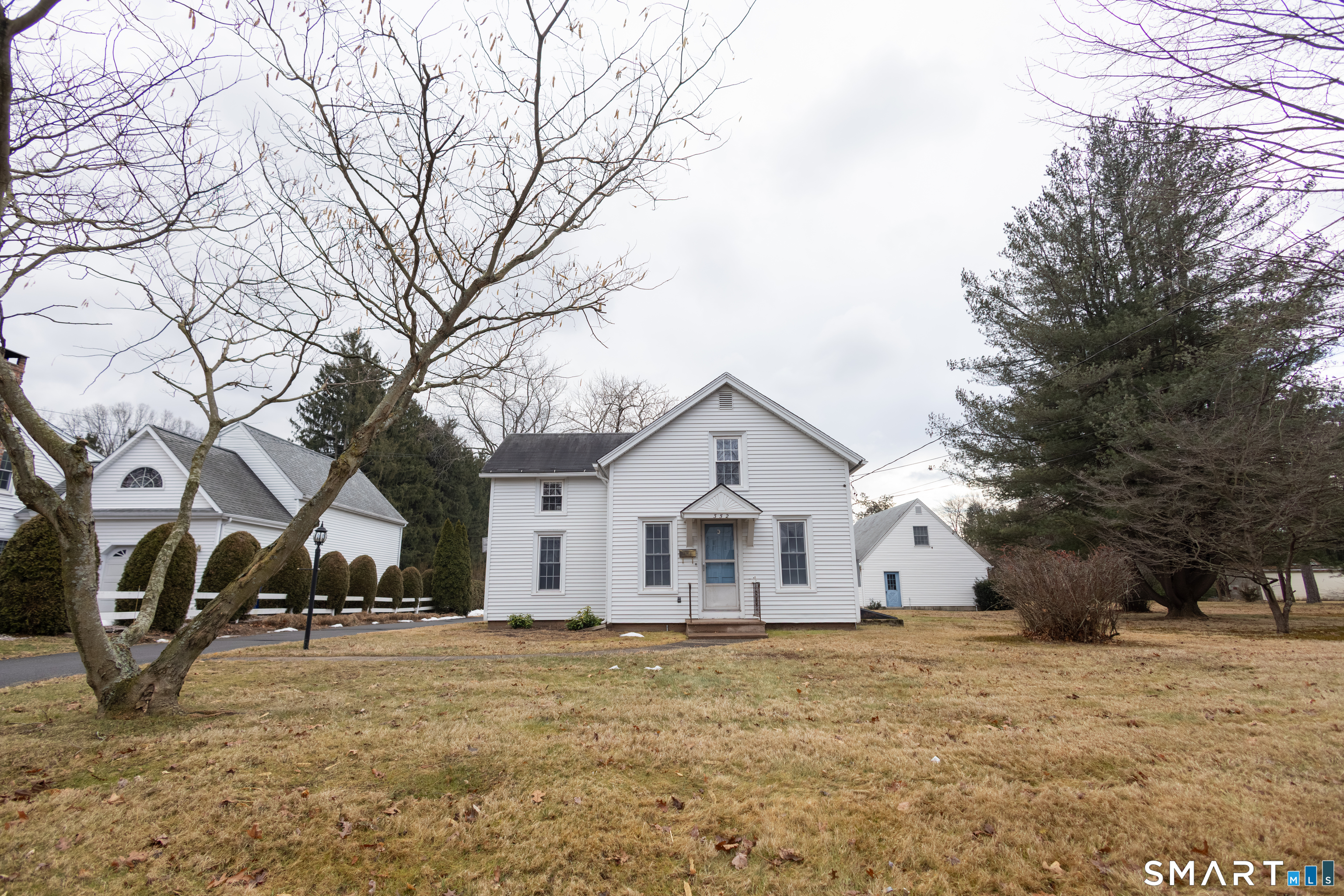352 Carter Lane Southington, CT 06489 - Photo 2 of 40 a view of a house with snow on the road