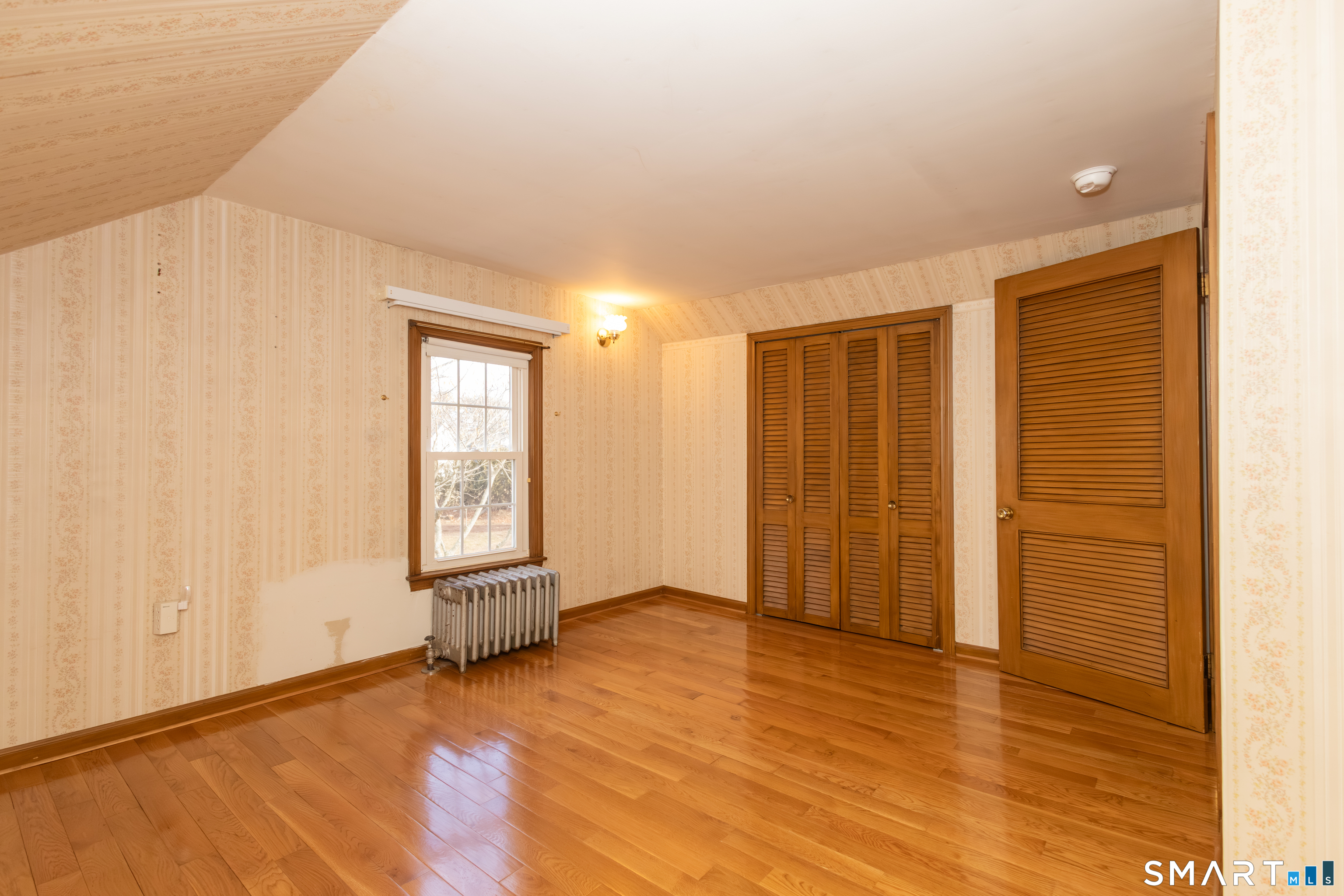 352 Carter Lane Southington, CT 06489 - Photo 29 of 40 an empty room with wooden floor and windows