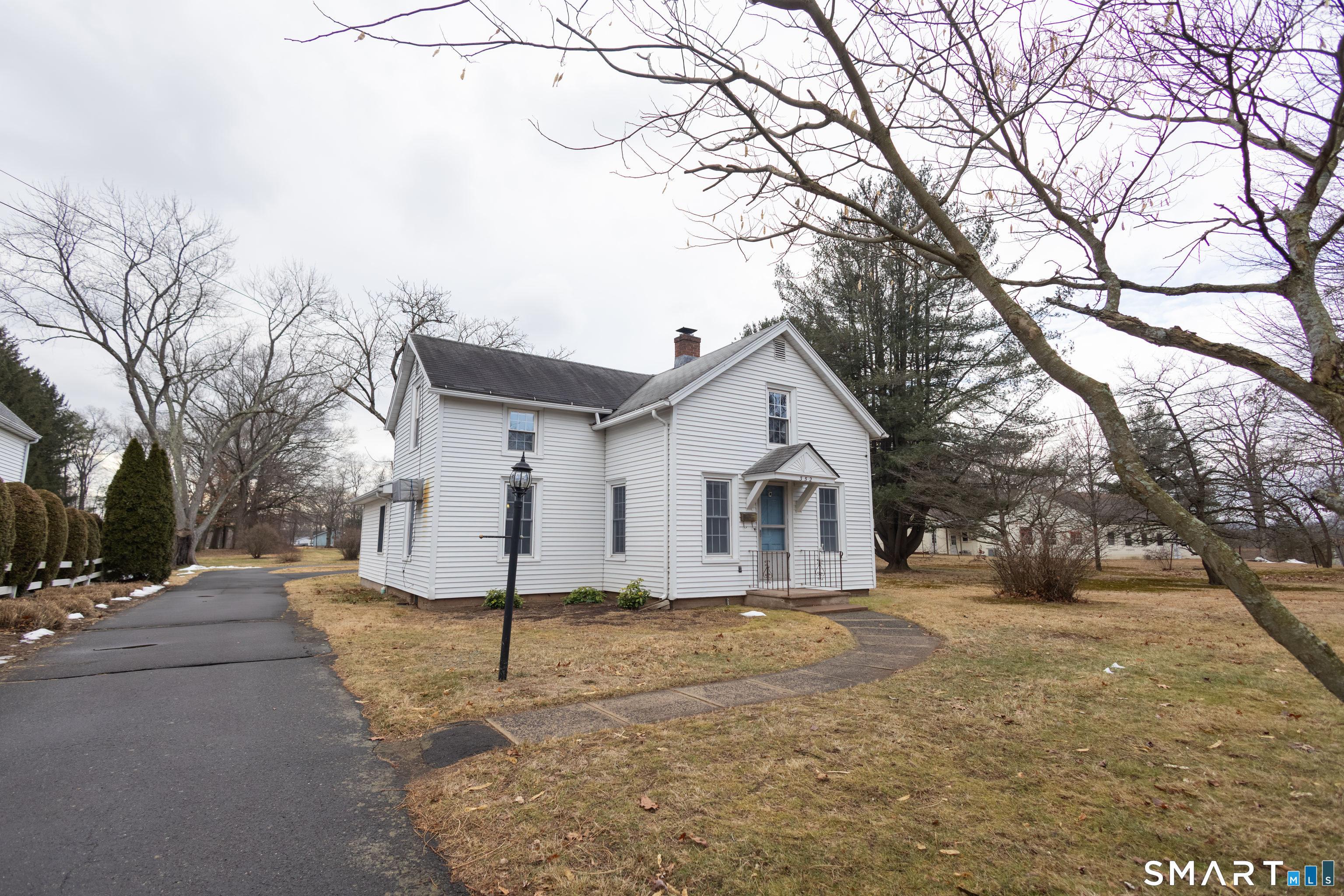 352 Carter Lane Southington, CT 06489 - Photo 3 of 40 a view of a house with a yard covered in snow