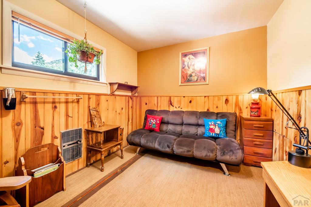 9600 Middle Creek Canyon Road Beulah, CO 81023 - Photo 28 of 50 a living room with furniture and a painting on the wall