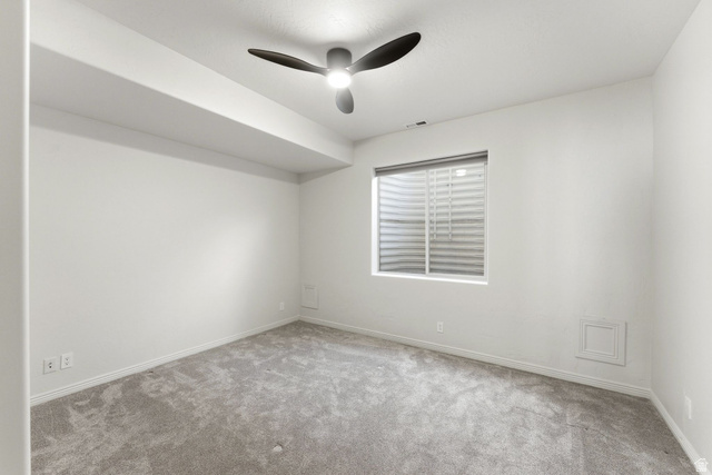 1712 Somerset Ridge Drive Draper, UT 84020 - Photo 63 of 76 Carpeted room featuring a ceiling fan with integrated lighting, a window with horizontal blinds, and clean white walls