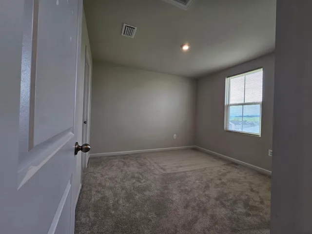 a front view of house with yard and trees