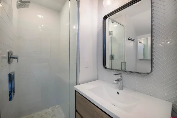 a bathroom with a sink and a mirror