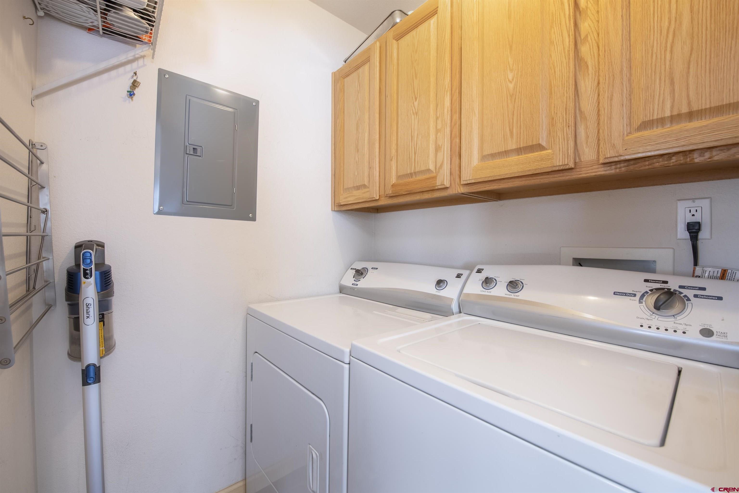 503 Red Lady Avenue, Unit 101 Crested Butte, CO 81224 - Photo 19 of 20 a utility room with dryer and washer