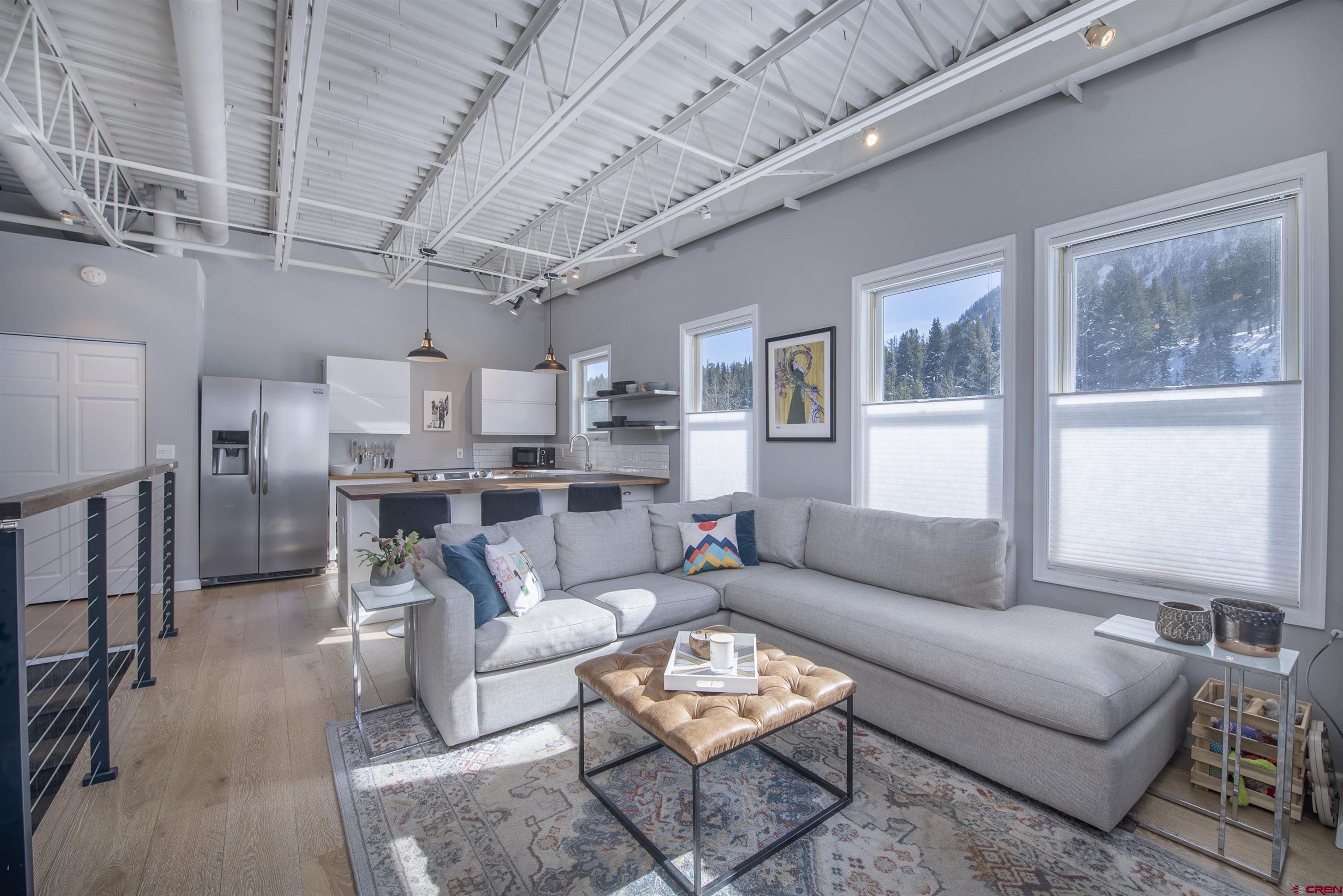 503 Red Lady Avenue, Unit 101 Crested Butte, CO 81224 - Photo 6 of 20 a living room with furniture kitchen view and a window