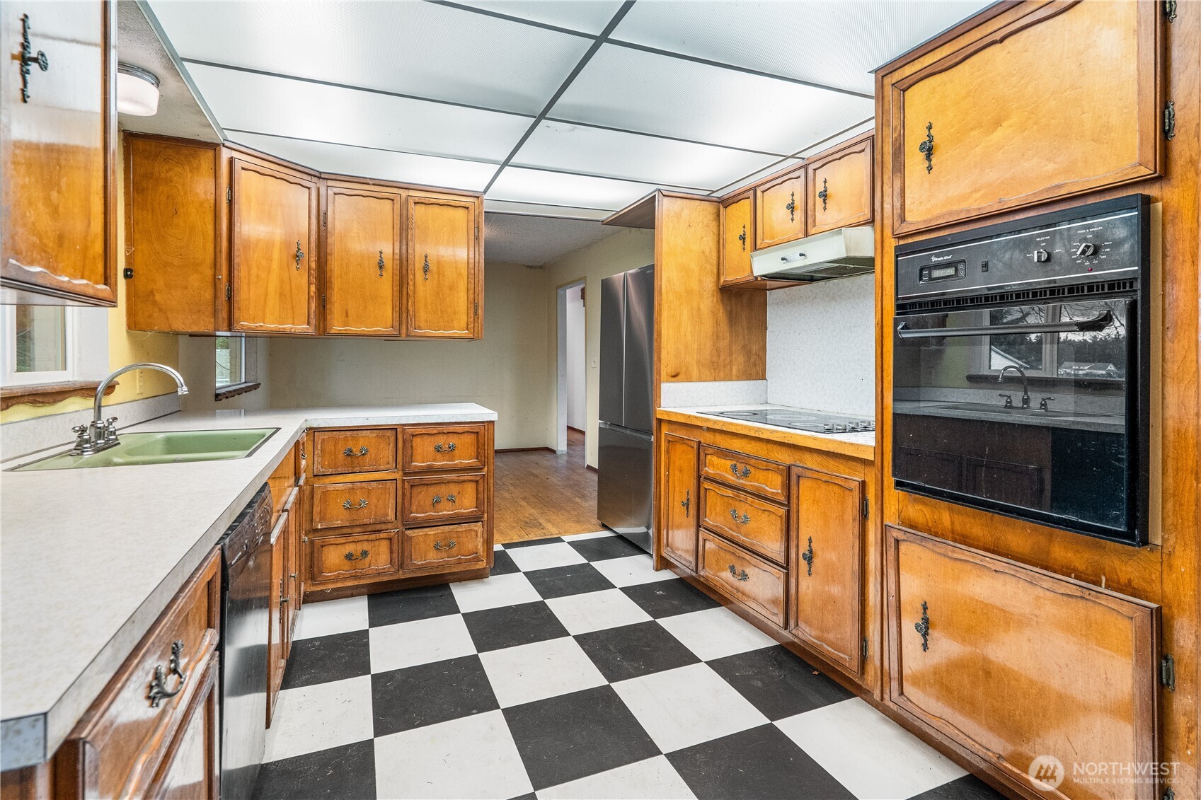 9139 Burnett Road Southeast Yelm, WA 98597 - Photo 12 of 40 a kitchen with stainless steel appliances granite countertop a refrigerator and a sink