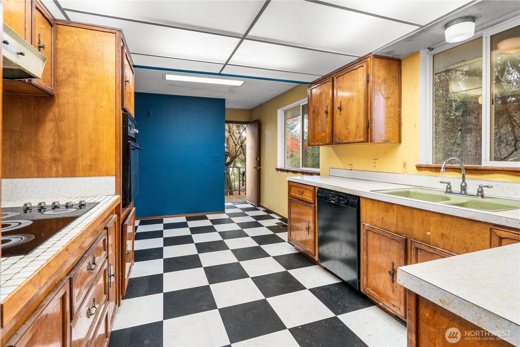 9139 Burnett Road Southeast Yelm, WA 98597 - Photo 13 of 40 a kitchen with a stove a sink and a refrigerator