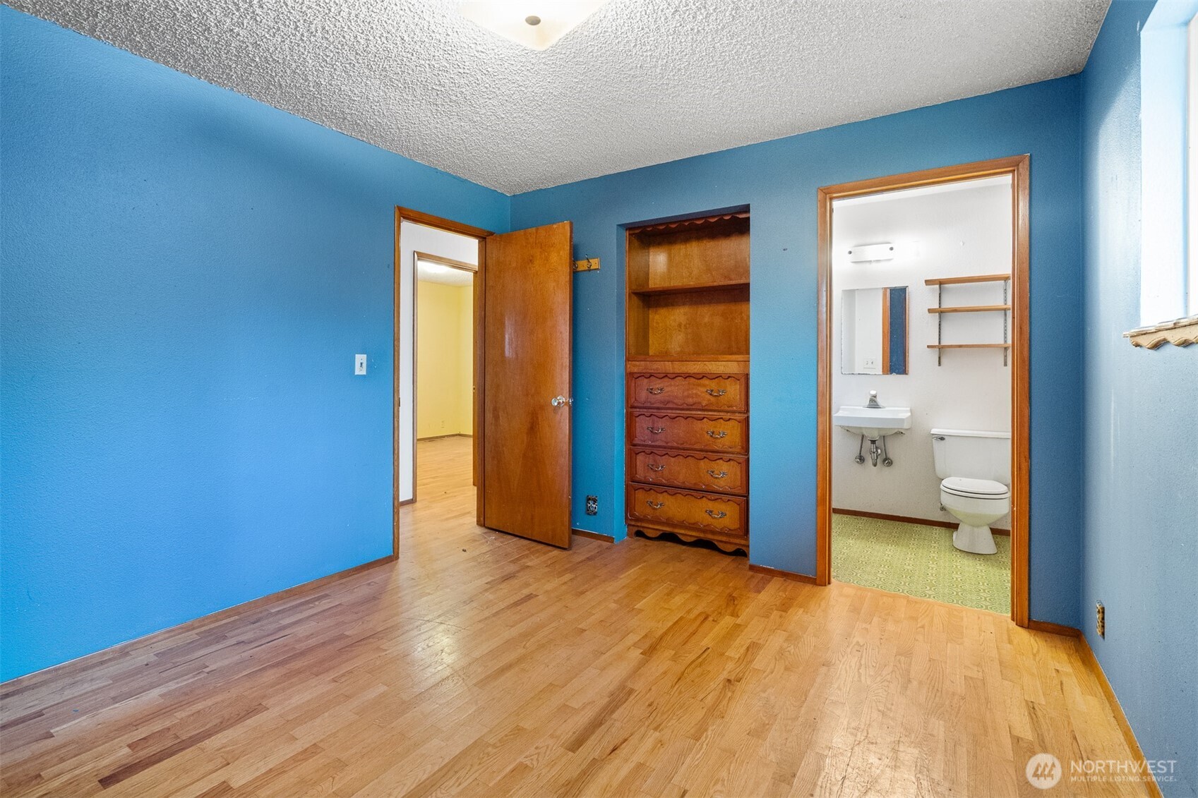 9139 Burnett Road Southeast Yelm, WA 98597 - Photo 15 of 40 a view of empty room with wooden floor and bathroom