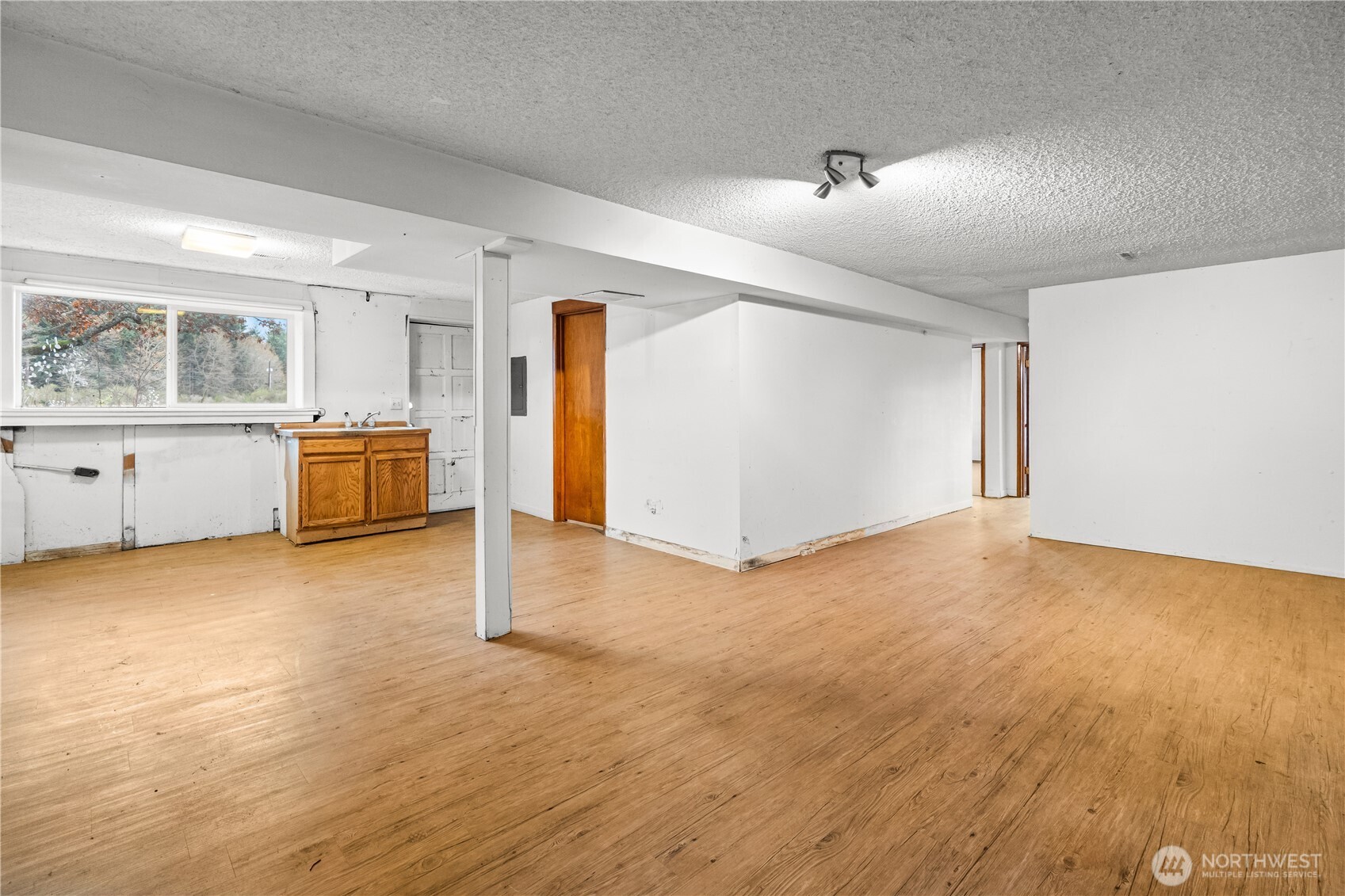 9139 Burnett Road Southeast Yelm, WA 98597 - Photo 23 of 40 a view of a kitchen with a sink dishwasher stove and cabinets