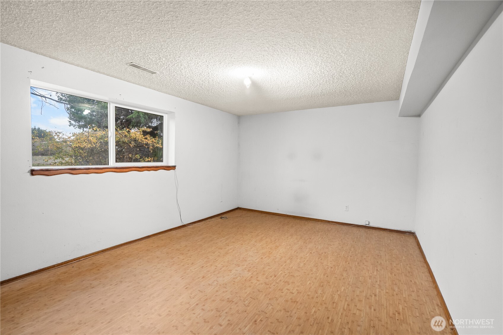 9139 Burnett Road Southeast Yelm, WA 98597 - Photo 25 of 40 an empty room with a window