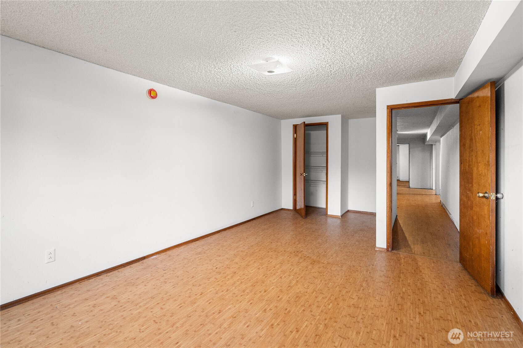9139 Burnett Road Southeast Yelm, WA 98597 - Photo 29 of 40 an empty room with wooden floor and windows