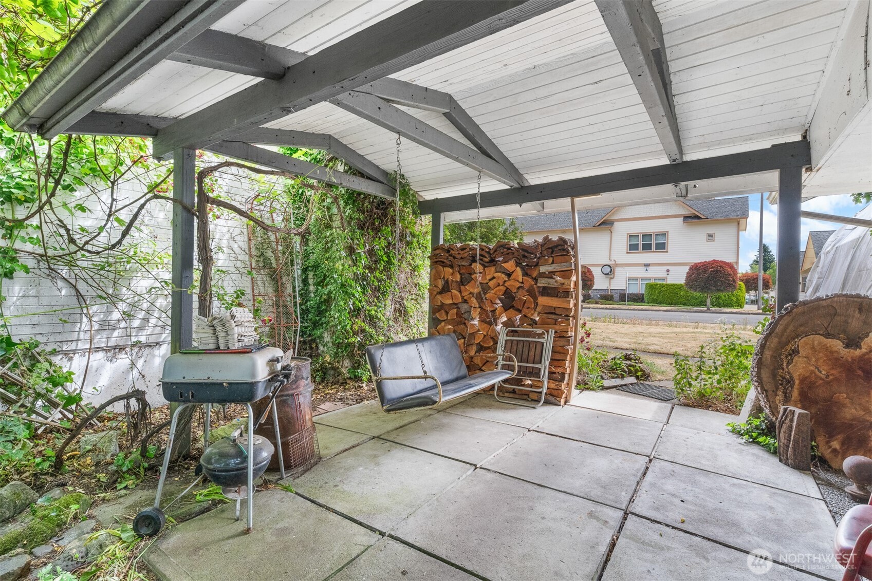 9139 Burnett Road Southeast Yelm, WA 98597 - Photo 31 of 40 a view of a chairs and table in a patio