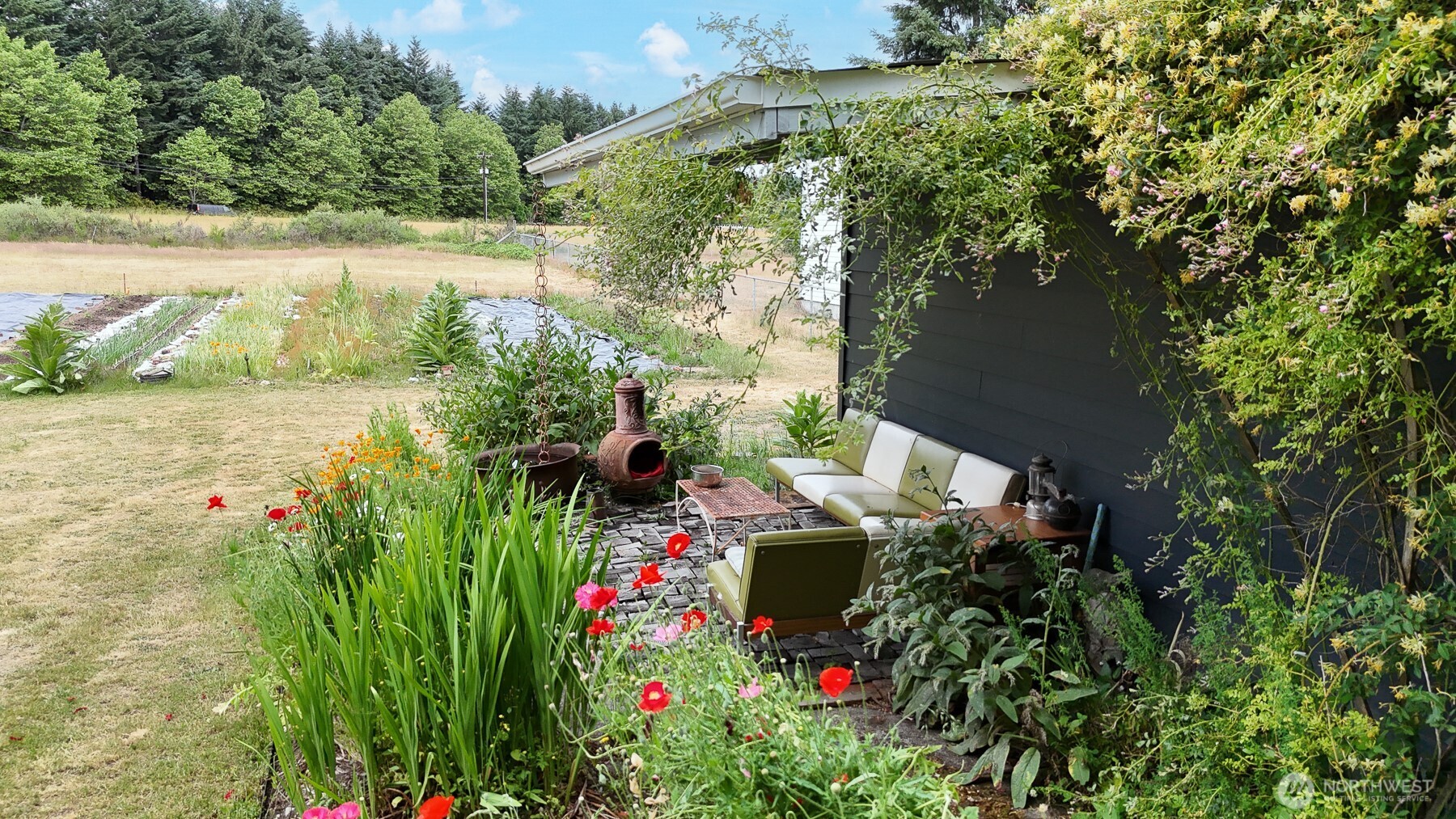 9139 Burnett Road Southeast Yelm, WA 98597 - Photo 35 of 40 a view of yard with seating area and trees around