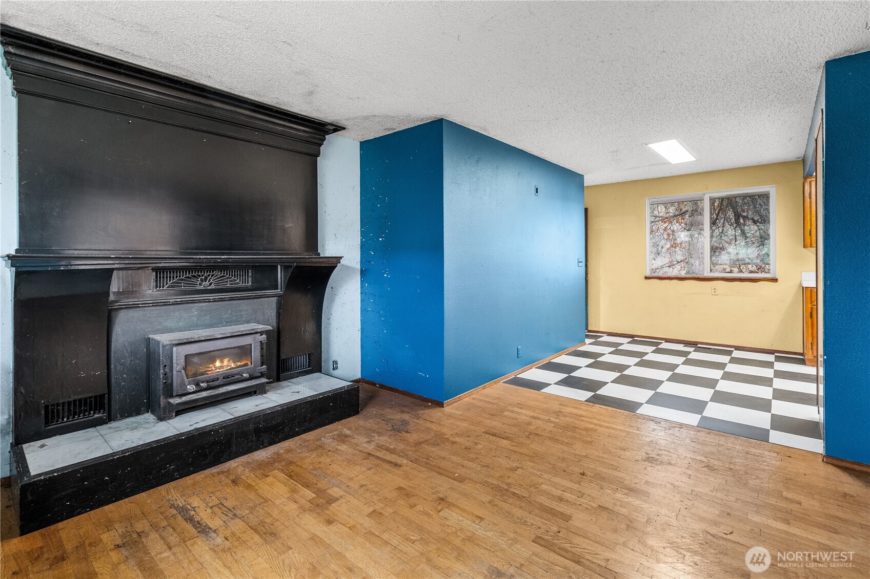 9139 Burnett Road Southeast Yelm, WA 98597 - Photo 8 of 40 a bedroom with a bed and a fireplace