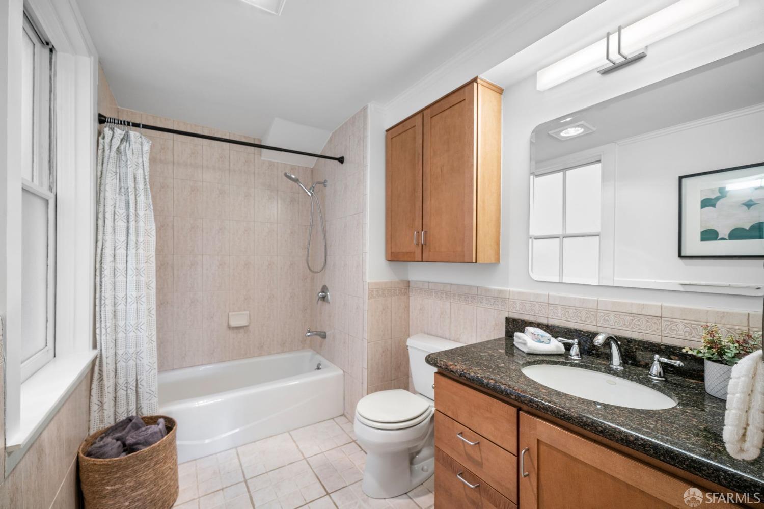333 Cherry Street, Unit B San Francisco, CA 94118 - Photo 19 of 34 a bathroom with a granite countertop sink toilet and shower