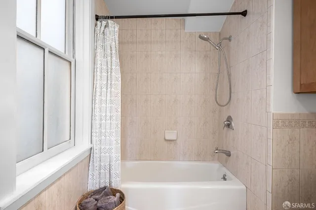 a bedroom with bed and wooden floor