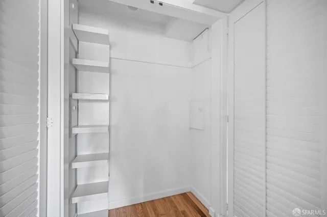 a view of an empty room with stairs